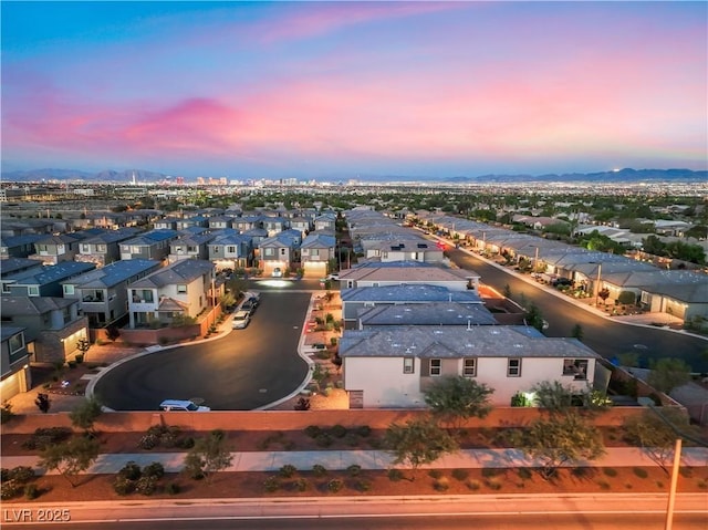 4152 Yucca Bloom St Unit 1, Las Vegas, NV 89135 - aerial view at dusk of a residential view and a mountain view