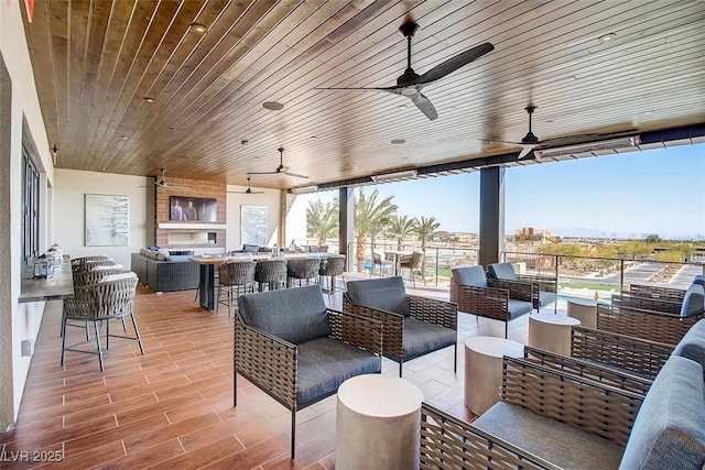 4152 Yucca Bloom St Unit 1, Las Vegas, NV 89135 - view of patio featuring outdoor lounge area, area for grilling, a ceiling fan, and exterior bar
