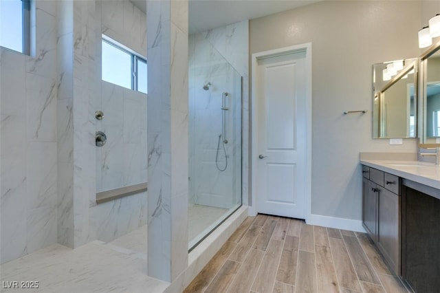 4152 Yucca Bloom St Unit 1, Las Vegas, NV 89135 - full bathroom featuring a marble finish shower, vanity, and wood finish floors