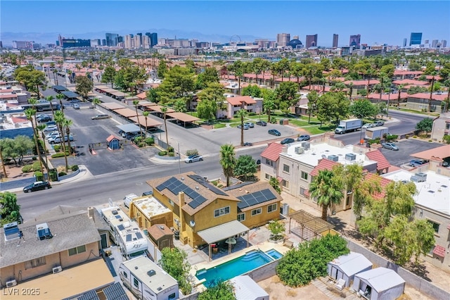 5134 Caliente St, Las Vegas, NV 89119 - drone / aerial view of skyline and a pool area