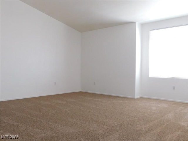 1128 Dusty Creek St, Las Vegas, NV 89128 - spare room featuring light colored carpet and baseboards