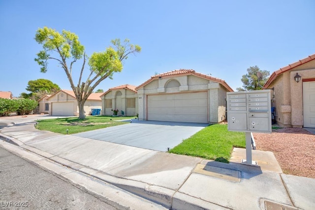 2912 Drury St, Las Vegas, NV 89108 - mediterranean / spanish-style house with concrete driveway, a tiled roof, a garage, and stucco siding