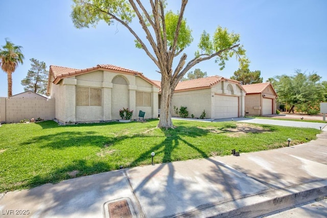 2912 Drury St, Las Vegas, NV 89108 - mediterranean / spanish-style home featuring a tiled roof, stucco siding, concrete driveway, and an attached garage