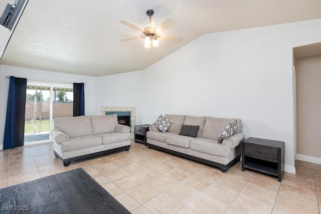 2912 Drury St, Las Vegas, NV 89108 - living area featuring vaulted ceiling, ceiling fan, a fireplace, and light tile patterned floors