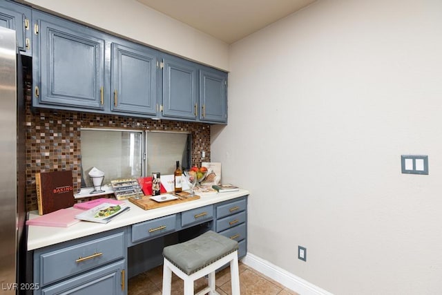 2912 Drury St, Las Vegas, NV 89108 - home office with built in desk and light tile patterned flooring