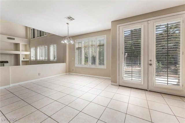 8901 Goldstone Ave, Las Vegas, NV 89143 - unfurnished dining area with a chandelier, light tile patterned flooring, and french doors