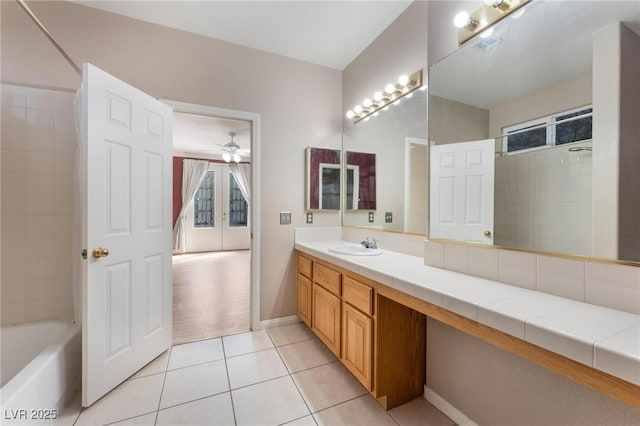 8901 Goldstone Ave, Las Vegas, NV 89143 - bathroom featuring vanity, tile patterned floors, a ceiling fan, and  shower combination