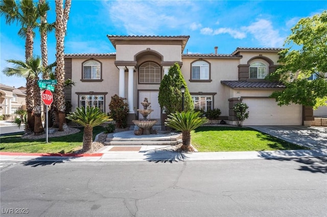 8901 Goldstone Ave, Las Vegas, NV 89143 - mediterranean / spanish-style home featuring stucco siding, concrete driveway, a garage, and a tiled roof