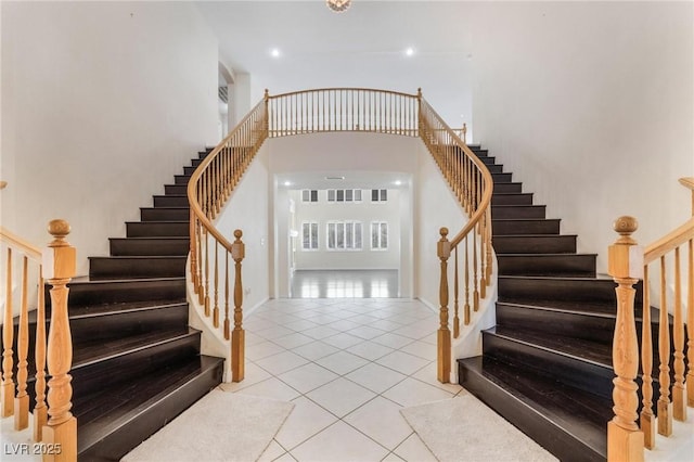 8901 Goldstone Ave, Las Vegas, NV 89143 - stairs with a towering ceiling and tile patterned flooring