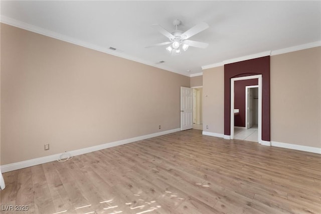 8901 Goldstone Ave, Las Vegas, NV 89143 - spare room featuring light wood-style flooring, crown molding, ceiling fan, and arched walkways