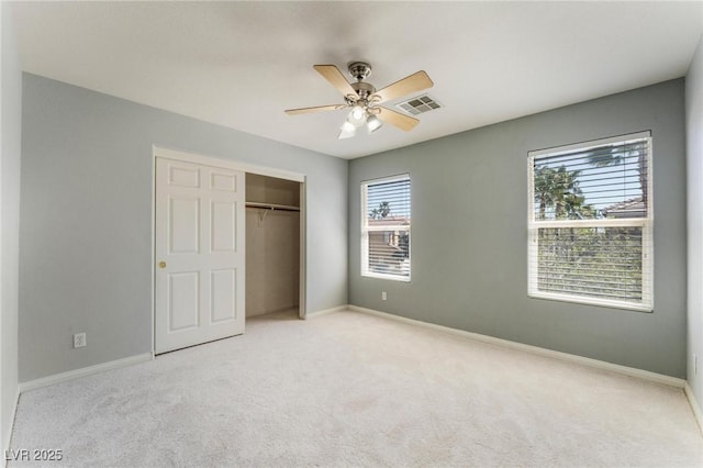 8901 Goldstone Ave, Las Vegas, NV 89143 - unfurnished bedroom featuring light colored carpet, a closet, and a ceiling fan