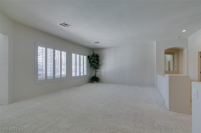 1414 Doggett Ave, Las Vegas, NV 89123 - empty room featuring carpet flooring, arched walkways, and recessed lighting