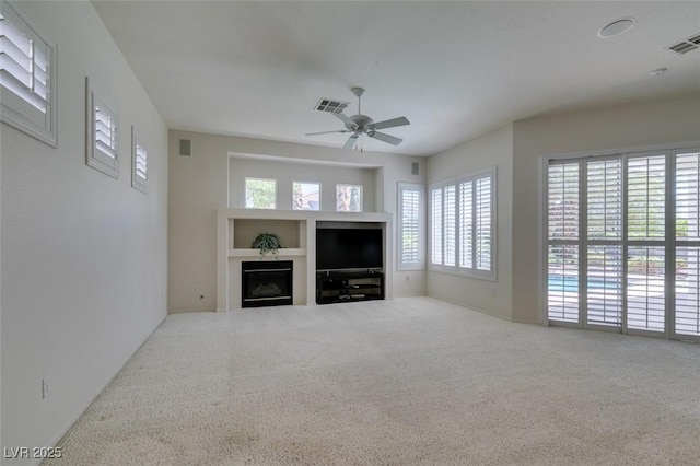 1414 Doggett Ave, Las Vegas, NV 89123 - unfurnished living room with carpet floors, a ceiling fan, and a fireplace
