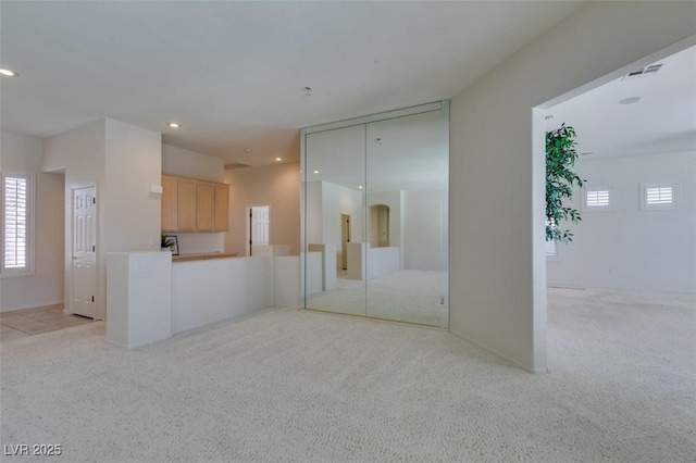 1414 Doggett Ave, Las Vegas, NV 89123 - unfurnished living room featuring light carpet and recessed lighting