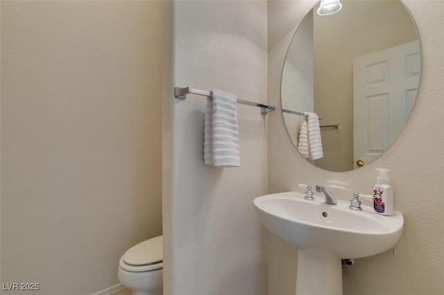 1414 Doggett Ave, Las Vegas, NV 89123 - bathroom featuring toilet and a sink