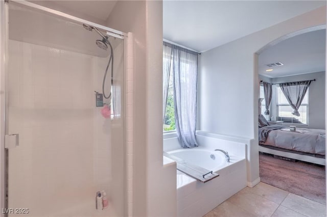9237 S Chieftain St, Las Vegas, NV 89178 - full bath with ensuite bath, a garden tub, a stall shower, and healthy amount of natural light