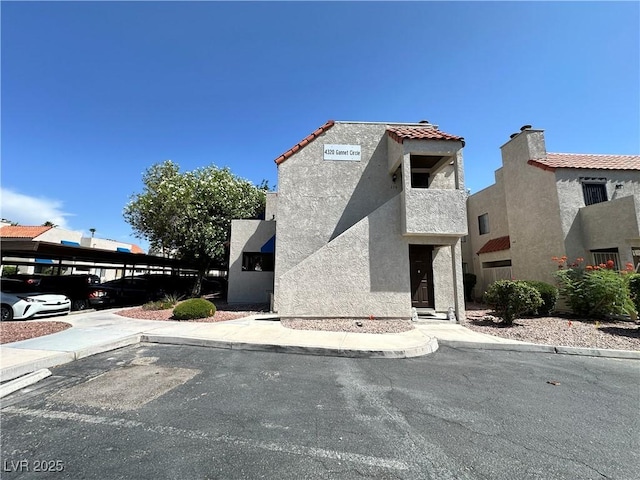4320 Gannet Cir Unit 116, Las Vegas, NV 89103 - view of front facade with stucco siding and a tile roof