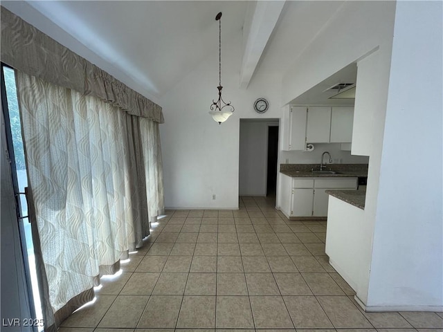 4320 Gannet Cir Unit 116, Las Vegas, NV 89103 - unfurnished dining area with lofted ceiling and light tile patterned floors