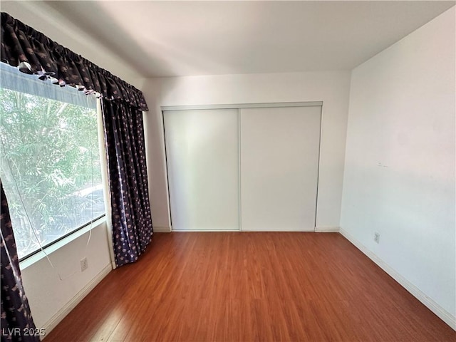 4320 Gannet Cir Unit 116, Las Vegas, NV 89103 - unfurnished bedroom with wood finished floors and a closet