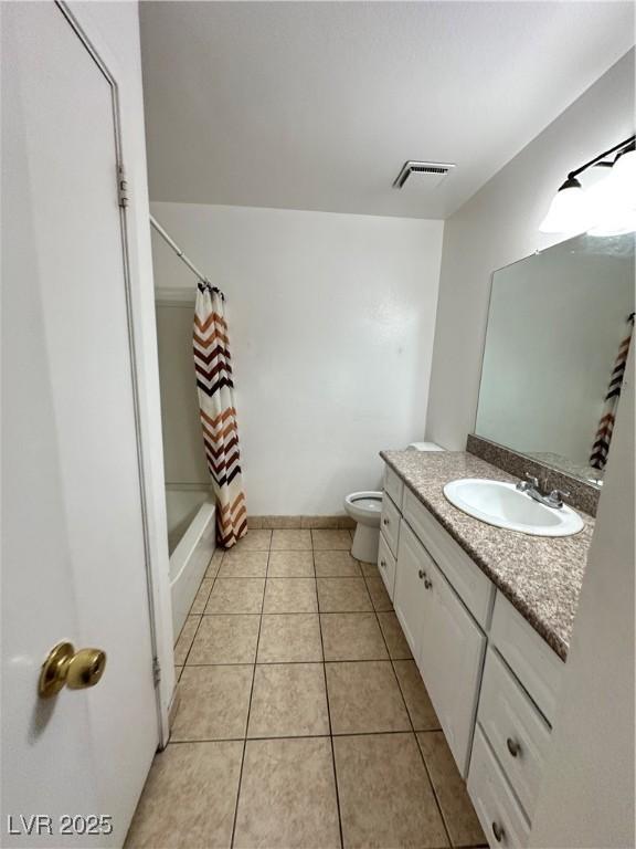 4320 Gannet Cir Unit 116, Las Vegas, NV 89103 - full bath featuring vanity, tile patterned floors, and shower / bath combo