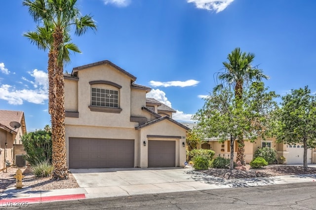 5209 Mantua Ct, Las Vegas, NV 89130 - view of front of house with stucco siding, driveway, and an attached garage