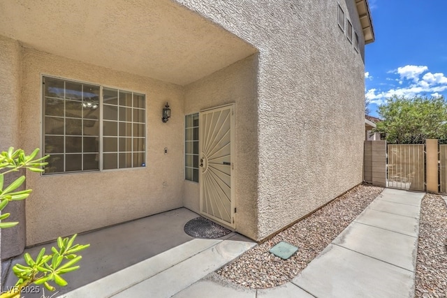 5209 Mantua Ct, Las Vegas, NV 89130 - entrance to property featuring stucco siding, a gate, and a patio