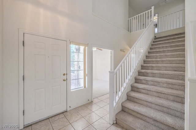 5209 Mantua Ct, Las Vegas, NV 89130 - foyer featuring stairs, light tile patterned floors, and a high ceiling