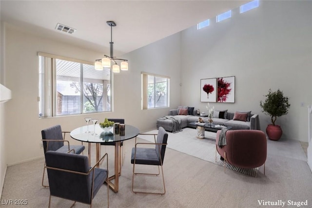 5209 Mantua Ct, Las Vegas, NV 89130 - dining area featuring carpet flooring and a chandelier