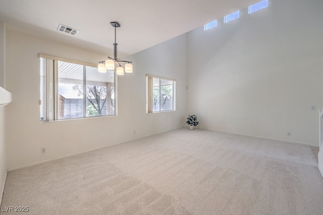 5209 Mantua Ct, Las Vegas, NV 89130 - spare room featuring carpet flooring and a chandelier