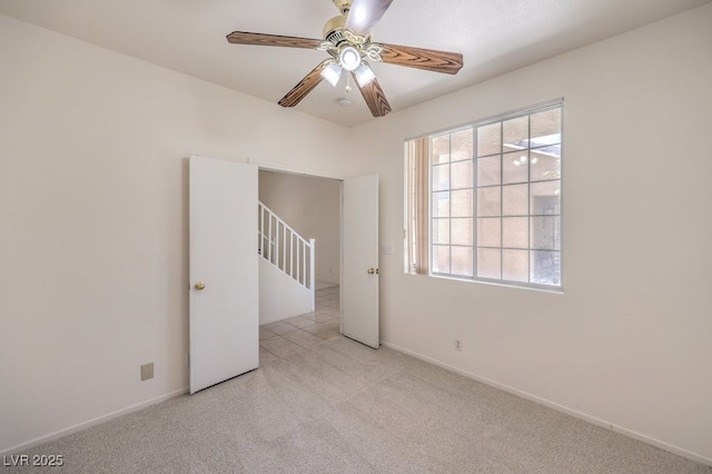 5209 Mantua Ct, Las Vegas, NV 89130 - unfurnished room featuring carpet floors, plenty of natural light, and a ceiling fan