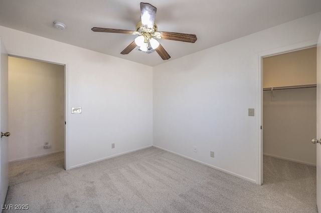 5209 Mantua Ct, Las Vegas, NV 89130 - unfurnished bedroom with carpet, a walk in closet, and a ceiling fan