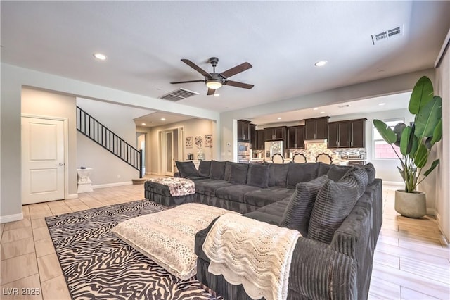 913 Silent Sunset Ave, North Las Vegas, NV 89084 - living room with stairs, a ceiling fan, and recessed lighting