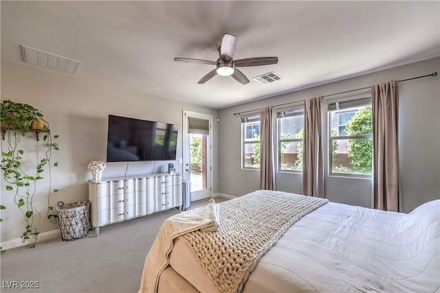 913 Silent Sunset Ave, North Las Vegas, NV 89084 - carpeted bedroom with multiple windows, ceiling fan, and access to exterior