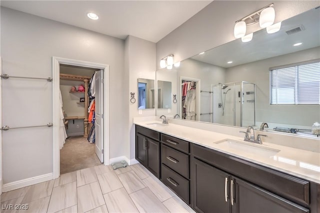 913 Silent Sunset Ave, North Las Vegas, NV 89084 - full bath with a walk in closet, a shower stall, double vanity, and recessed lighting