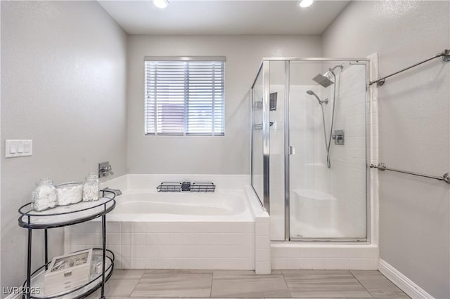 913 Silent Sunset Ave, North Las Vegas, NV 89084 - bathroom featuring a stall shower, a garden tub, and recessed lighting