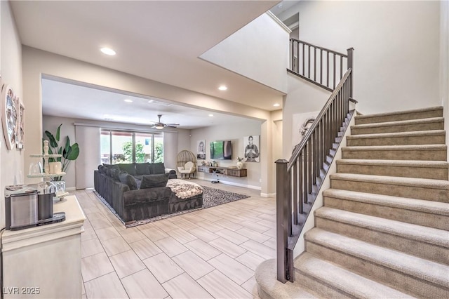 913 Silent Sunset Ave, North Las Vegas, NV 89084 - living room with ceiling fan, stairway, recessed lighting, and tile patterned floors