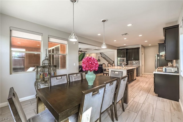 913 Silent Sunset Ave, North Las Vegas, NV 89084 - dining space with stairs and recessed lighting