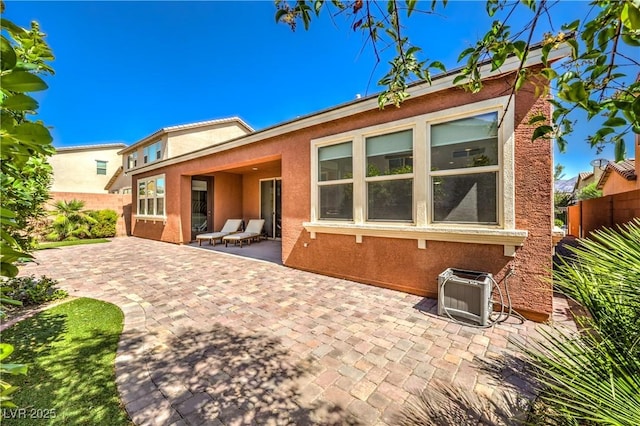 913 Silent Sunset Ave, North Las Vegas, NV 89084 - rear view of house featuring a patio and stucco siding
