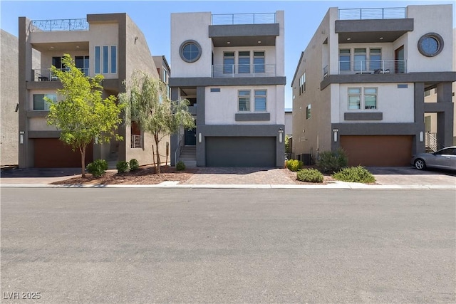 8144 Monsoon Bay St, Las Vegas, NV 89113 - modern home featuring stucco siding, a garage, and driveway