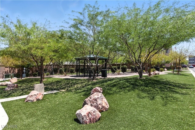 8144 Monsoon Bay St, Las Vegas, NV 89113 - view of property's community with a gazebo and a yard