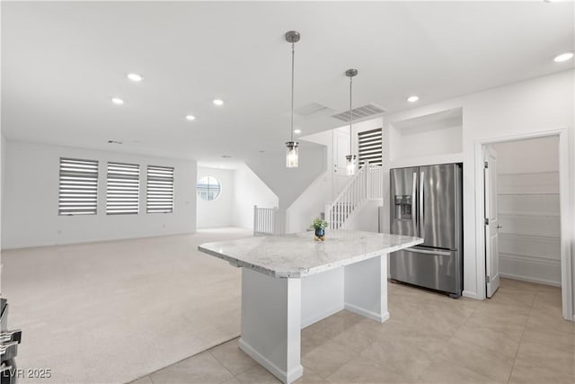 8144 Monsoon Bay St, Las Vegas, NV 89113 - kitchen featuring stainless steel fridge, recessed lighting, a kitchen island, light stone countertops, and pendant lighting
