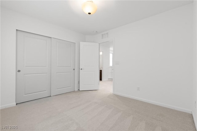 8144 Monsoon Bay St, Las Vegas, NV 89113 - unfurnished bedroom featuring light carpet and a closet