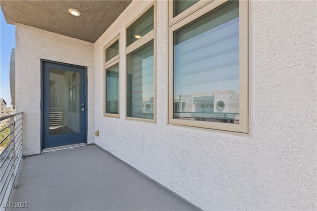 8144 Monsoon Bay St, Las Vegas, NV 89113 - entrance to property featuring stucco siding and a balcony