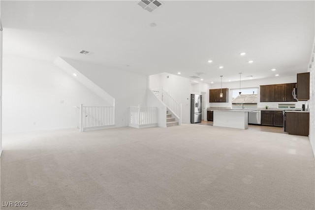8144 Monsoon Bay St, Las Vegas, NV 89113 - unfurnished living room with recessed lighting and light carpet