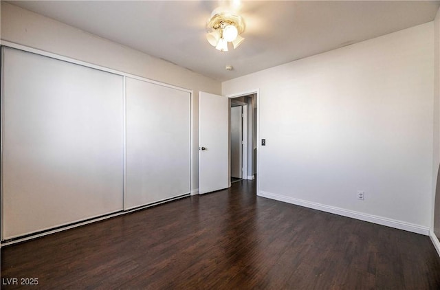 4130 Neighborly Ct, North Las Vegas, NV 89032 - unfurnished bedroom with wood finished floors, a closet, and a ceiling fan