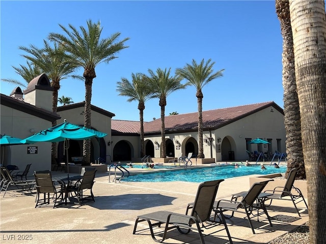3813 Jasmine Heights Ave, North Las Vegas, NV 89081 - community pool with a patio area
