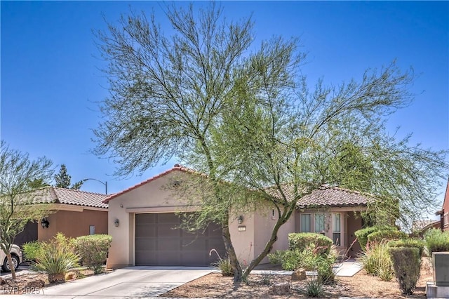 3813 Jasmine Heights Ave, North Las Vegas, NV 89081 - mediterranean / spanish home with a garage, a tile roof, driveway, and stucco siding