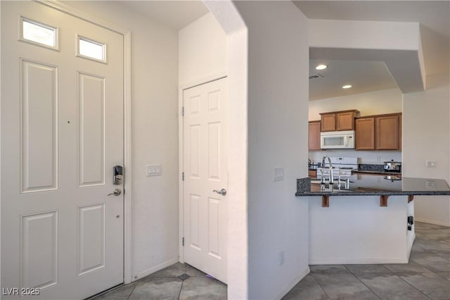 3813 Jasmine Heights Ave, North Las Vegas, NV 89081 - foyer entrance with arched walkways, recessed lighting, and tile patterned floors