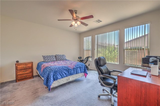 3813 Jasmine Heights Ave, North Las Vegas, NV 89081 - carpeted bedroom with a desk and a ceiling fan