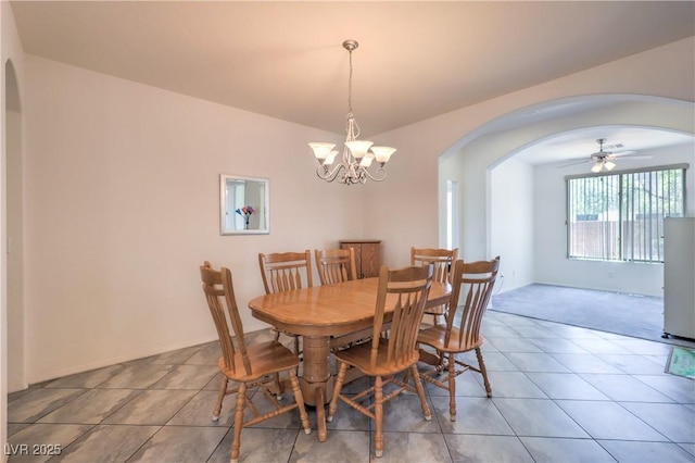 3813 Jasmine Heights Ave, North Las Vegas, NV 89081 - dining area with arched walkways, a chandelier, and light tile patterned floors
